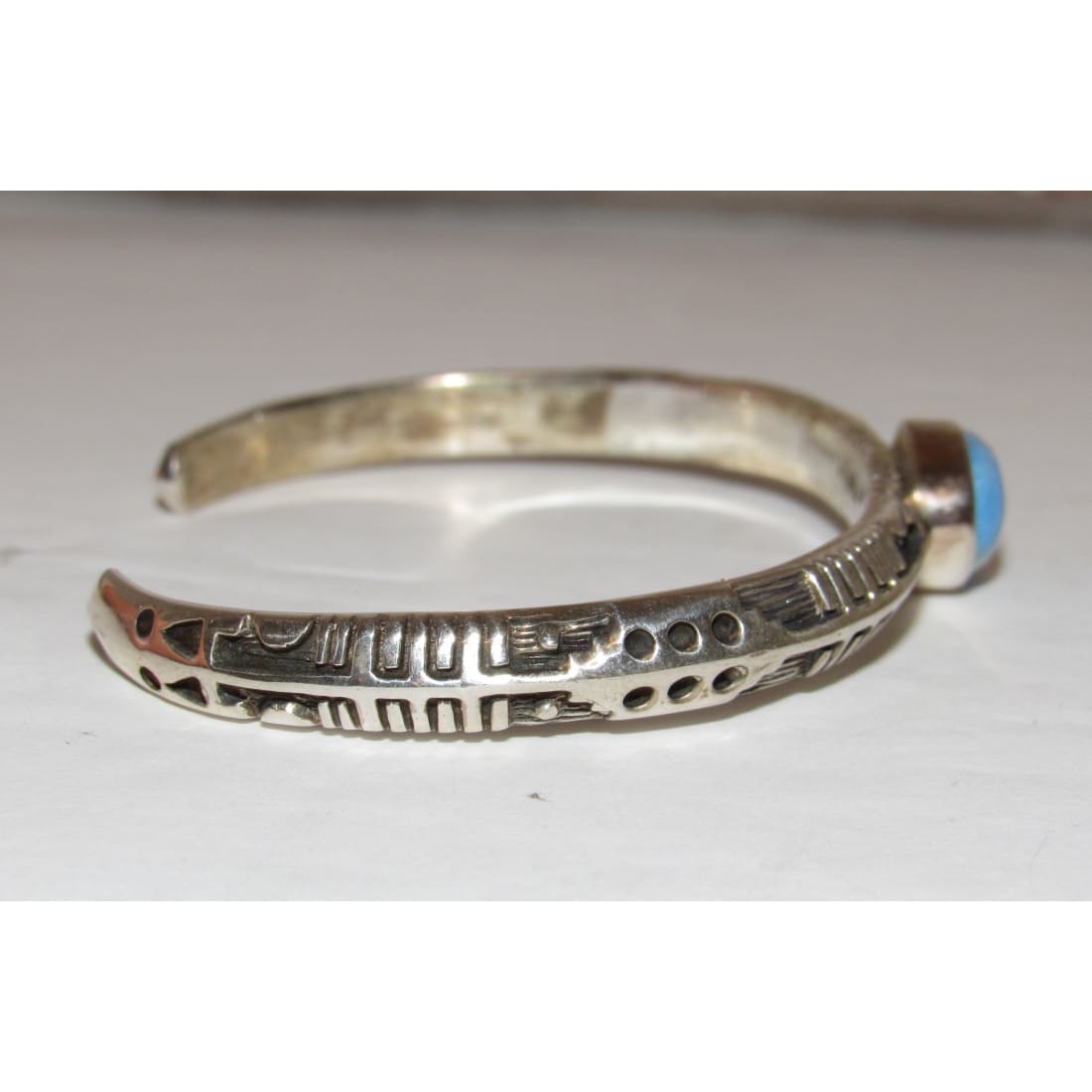 Native American Navajo Golden Hills turquoise sterling bracelet with intricate silver designs