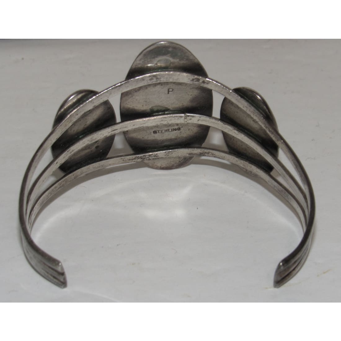 Native American Navajo onyx cuff bracelet with silver openwork design and three black onyx stones