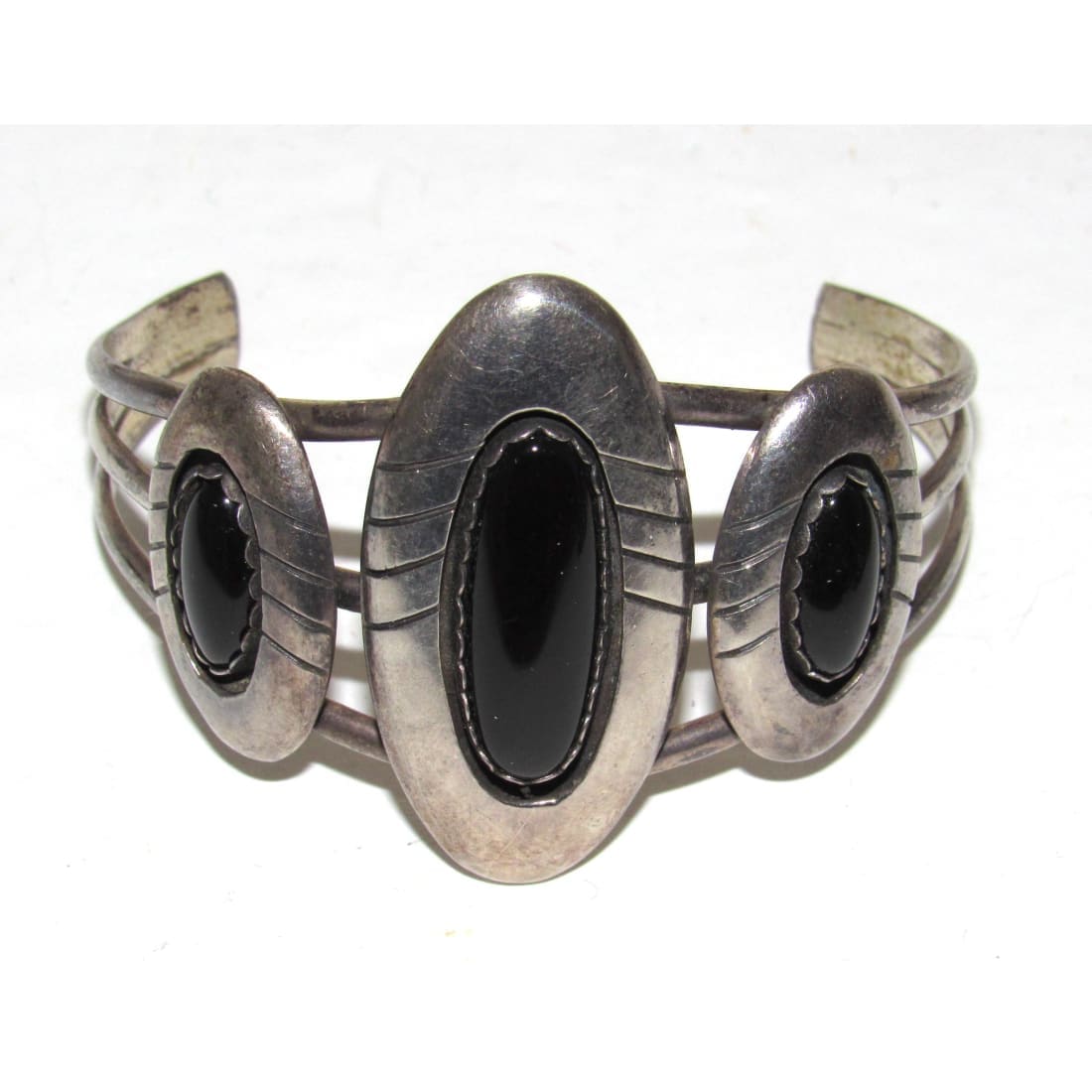 Native American Navajo onyx cuff bracelet featuring three black onyx stones set in silver