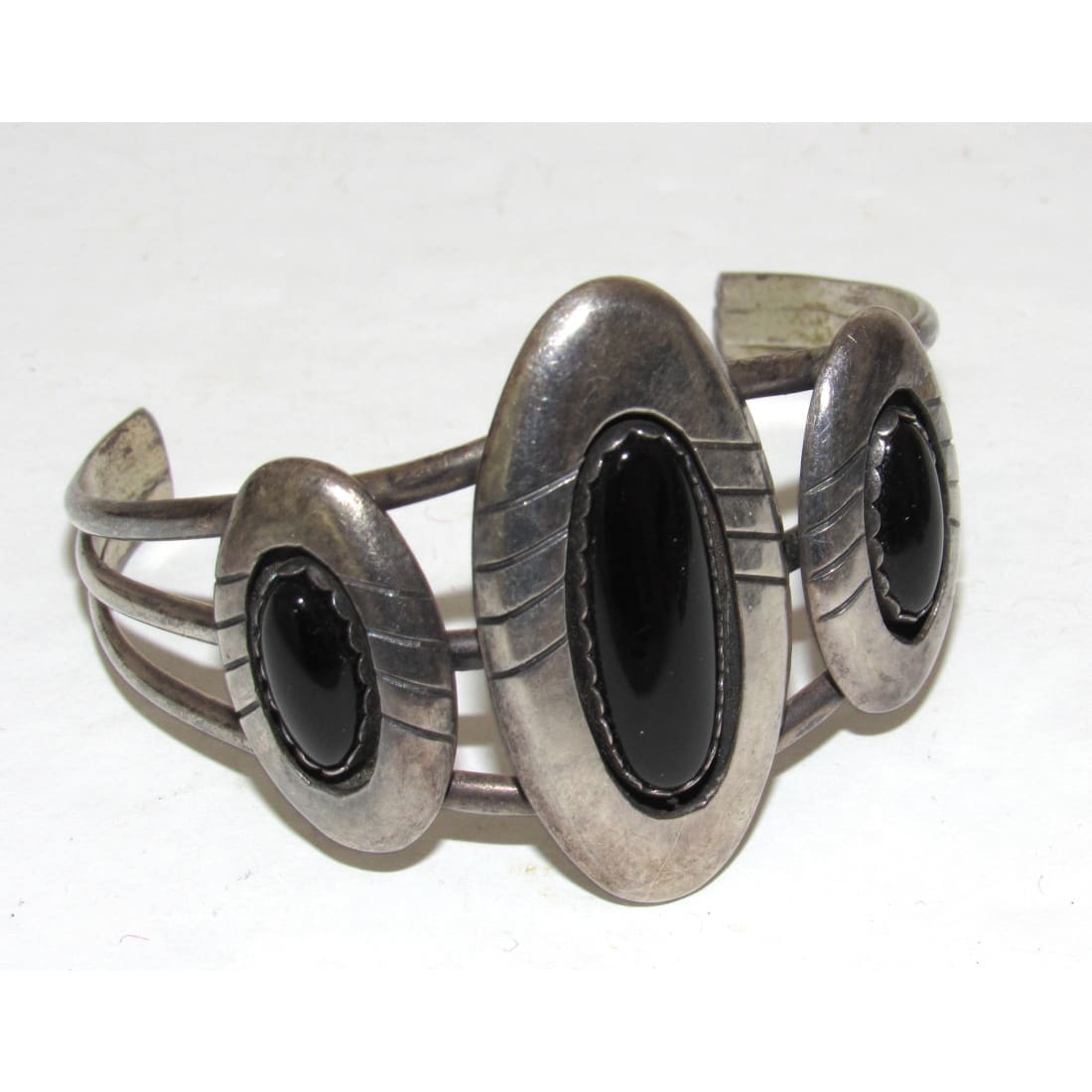 Native American Navajo onyx cuff bracelet with polished black stones and silver metalwork