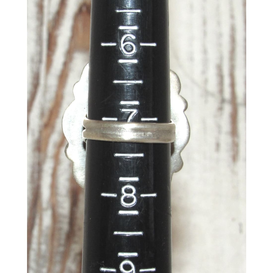 Navajo Blue Royston turquoise sterling ring sz 7 displayed on black ring sizing tool