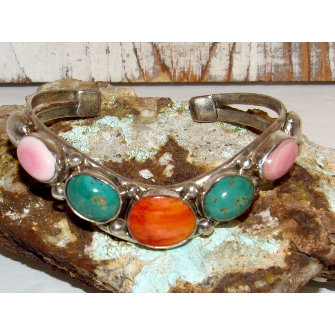 Navajo turquoise spiny oyster cuff bracelet Dave Lister featuring vibrant turquoise and orange stones on silver