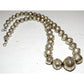 Navajo pearls necklace featuring graduated hand stamped sterling silver beads, measuring 18 inches long.