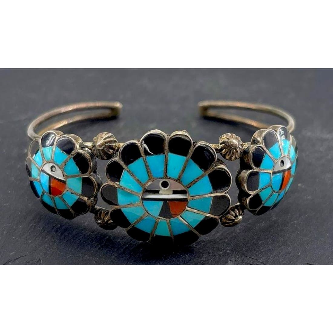 Vintage Zuni sterling silver sunface turquoise bracelet with intricate inlay and signed craftsmanship.
