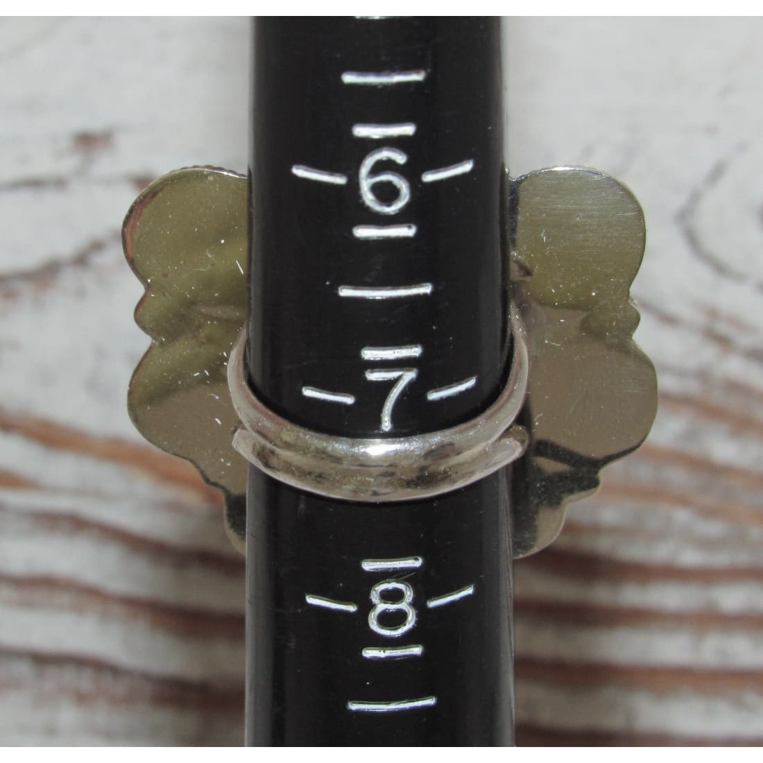 Navajo Turquoise Naja ring size 8 displayed on a ring sizer showing size 7 and 8.