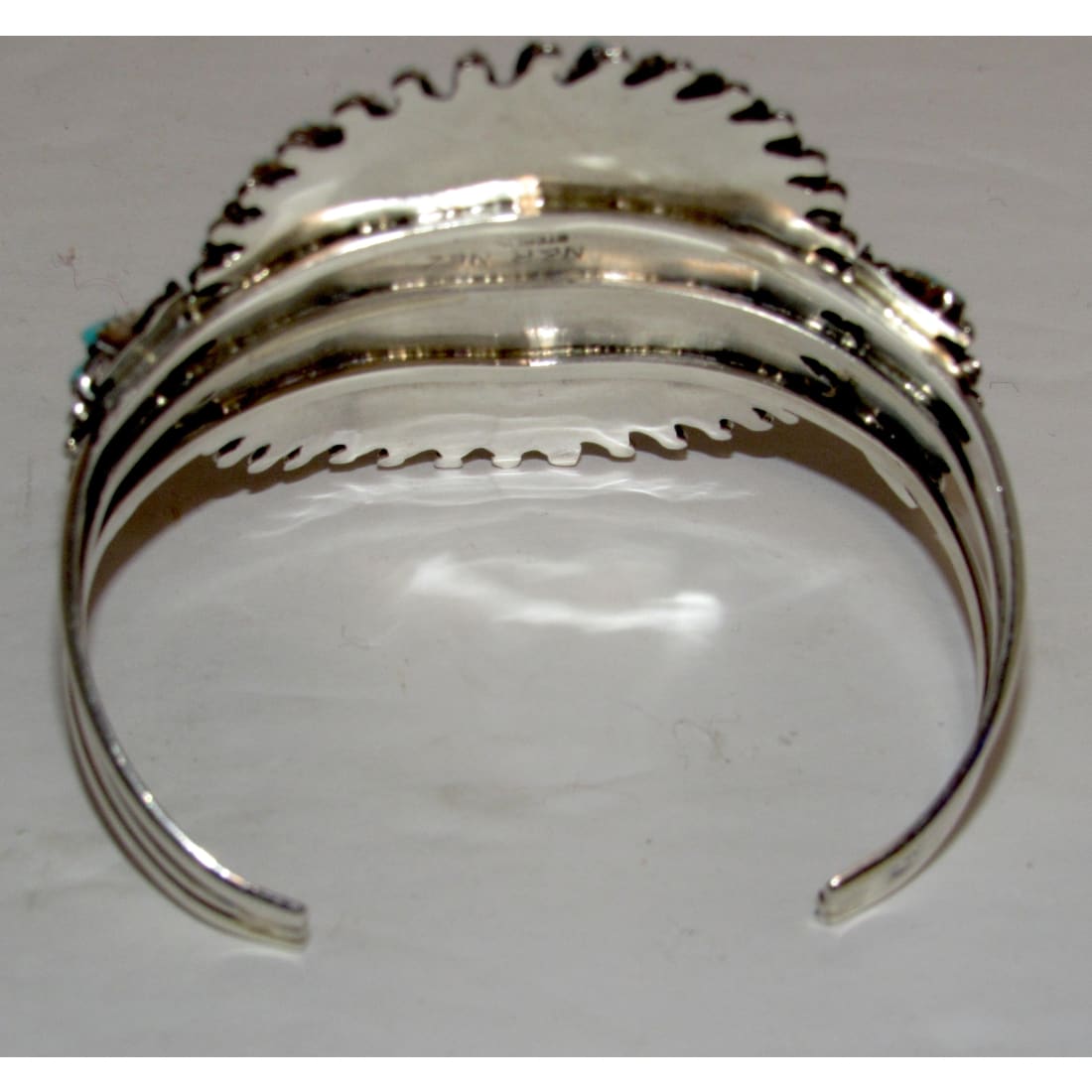 Navajo turquoise cluster cuff bracelet view showing inner design and sterling silver craftsmanship.