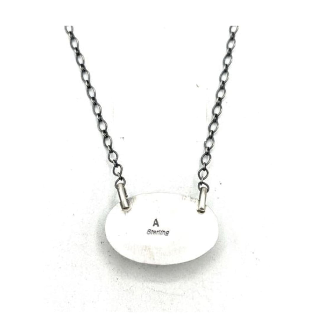 Navajo turquoise bar necklace with A Martinez signature and sterling silver chain detail.