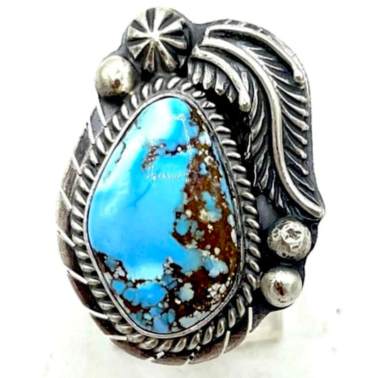 Navajo Golden Hills turquoise ring featuring a stunning blue stone and detailed silverwork by G. Nez.