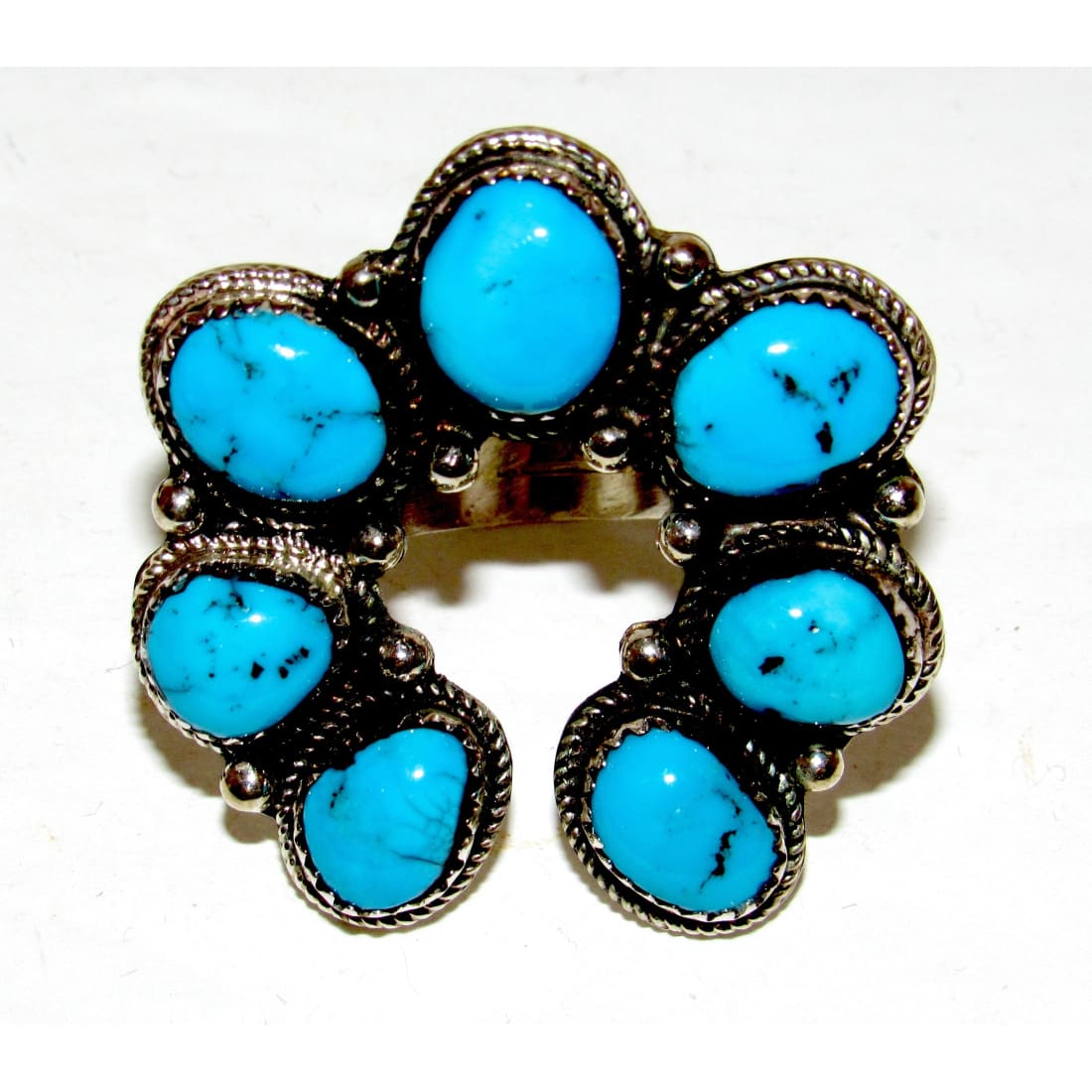 Navajo Turquoise Naja ring size 8 featuring vibrant Kingman turquoise stones set in sterling silver.