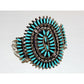 Navajo turquoise cluster cuff bracelet featuring vibrant Sleeping Beauty turquoise stones and intricate silver detailing.