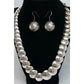Vintage Navajo pearls necklace earrings set featuring hand etched ingot pillow beads on a foxtail chain.