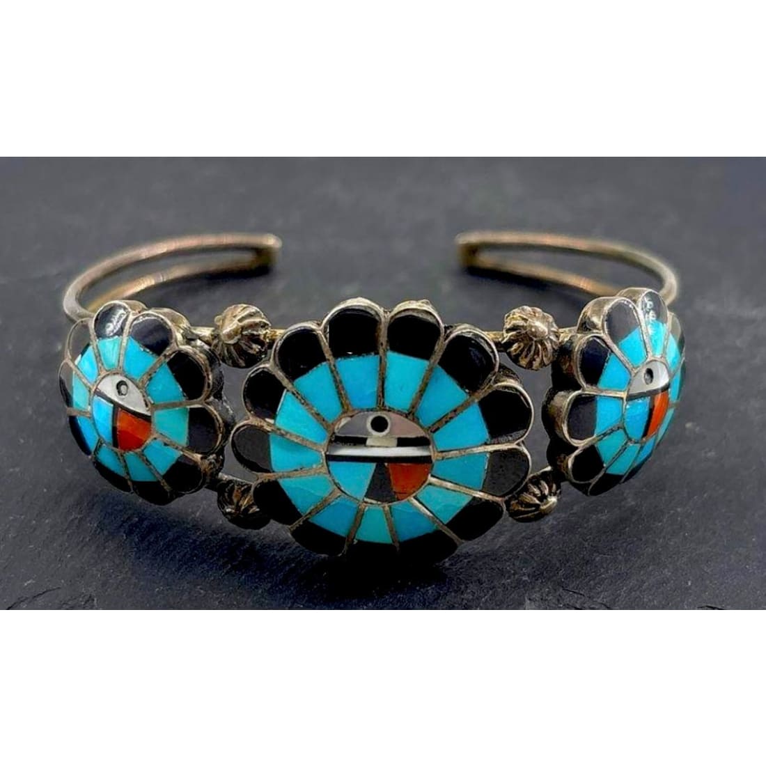 Vintage Zuni sterling silver sunface turquoise bracelet with intricate inlay design and signed artist craftsmanship.