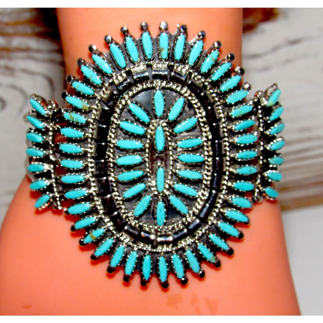 Navajo turquoise cluster cuff bracelet featuring stunning turquoise stones and intricate silver detailing.
