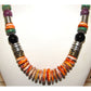 Navajo Tommy Singer orange spiny oyster necklace with vibrant shells and sterling silver accents, 20 inches long.
