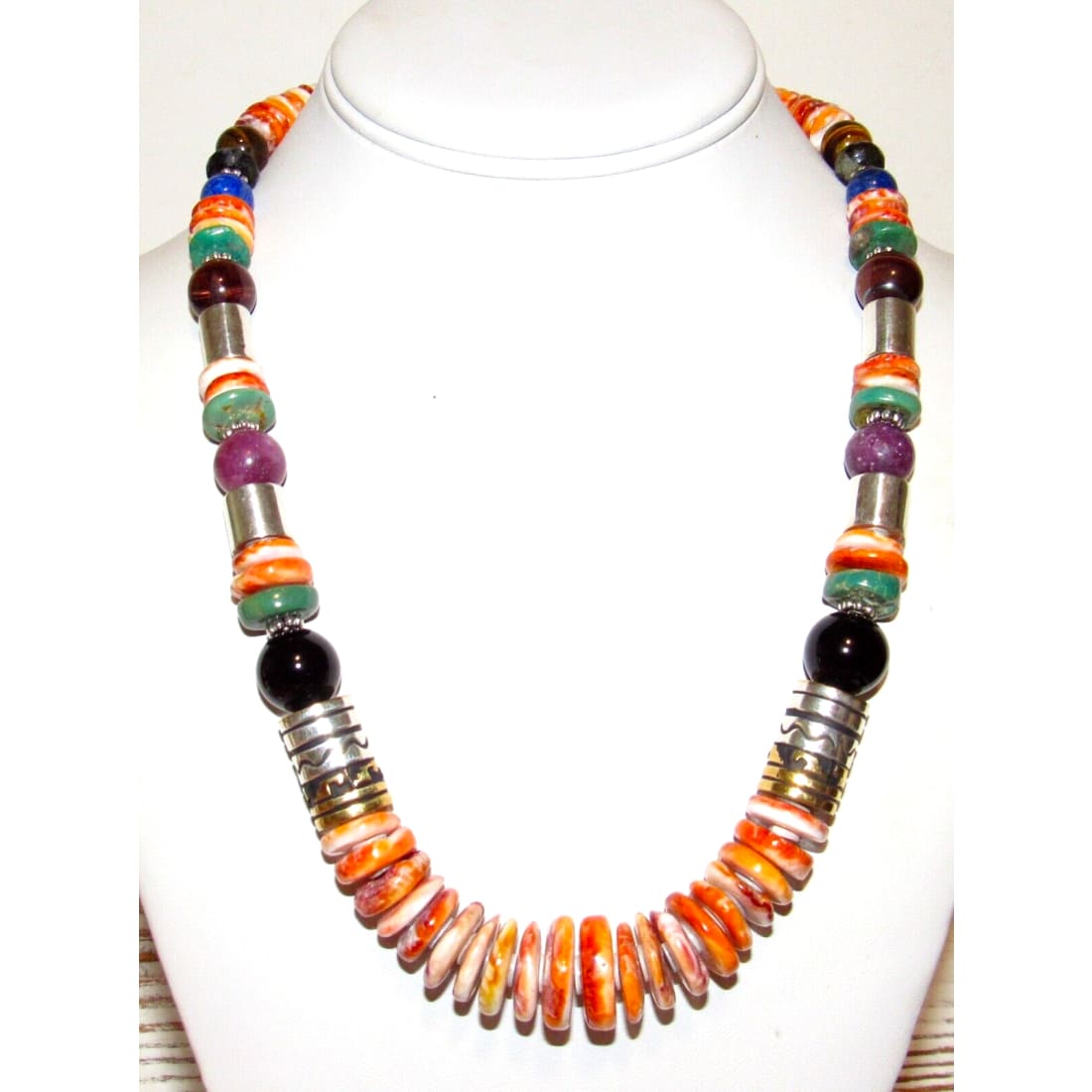 Navajo Tommy Singer orange spiny oyster necklace showcasing vibrant shells and artisan craftsmanship.