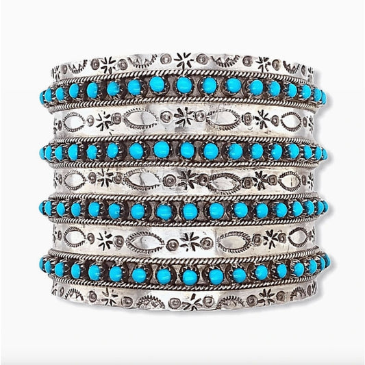 Sterling Zuni turquoise cuff bracelet with detailed silver engravings and multiple turquoise stone rows