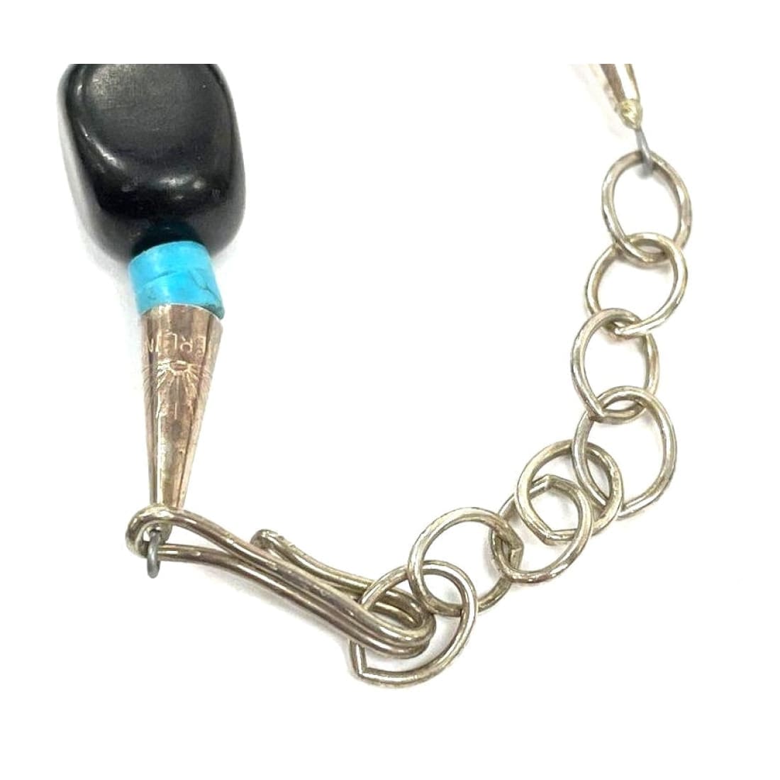 Close-up of the clasp and chain links of Joseph Tenorio Santo Domingo onyx necklace with turquoise and silver details