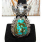 Native American Navajo turquoise kachina ring with detailed silverwork and vibrant turquoise stone
