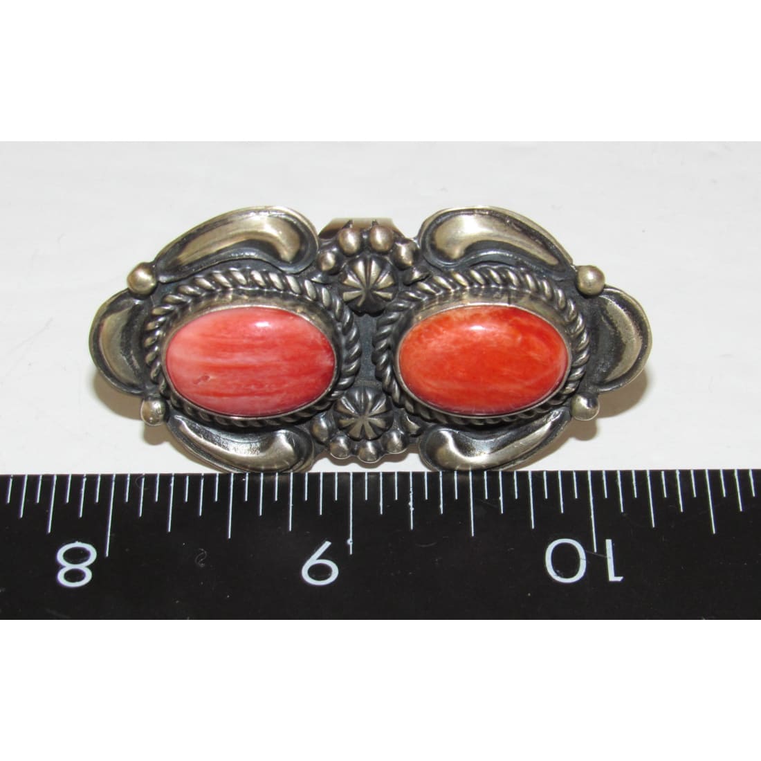 Native American Navajo red spiny oyster ring with two oval stones and intricate silver detailing