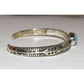 Native American Navajo Golden Hills turquoise sterling bracelet with intricate silver designs