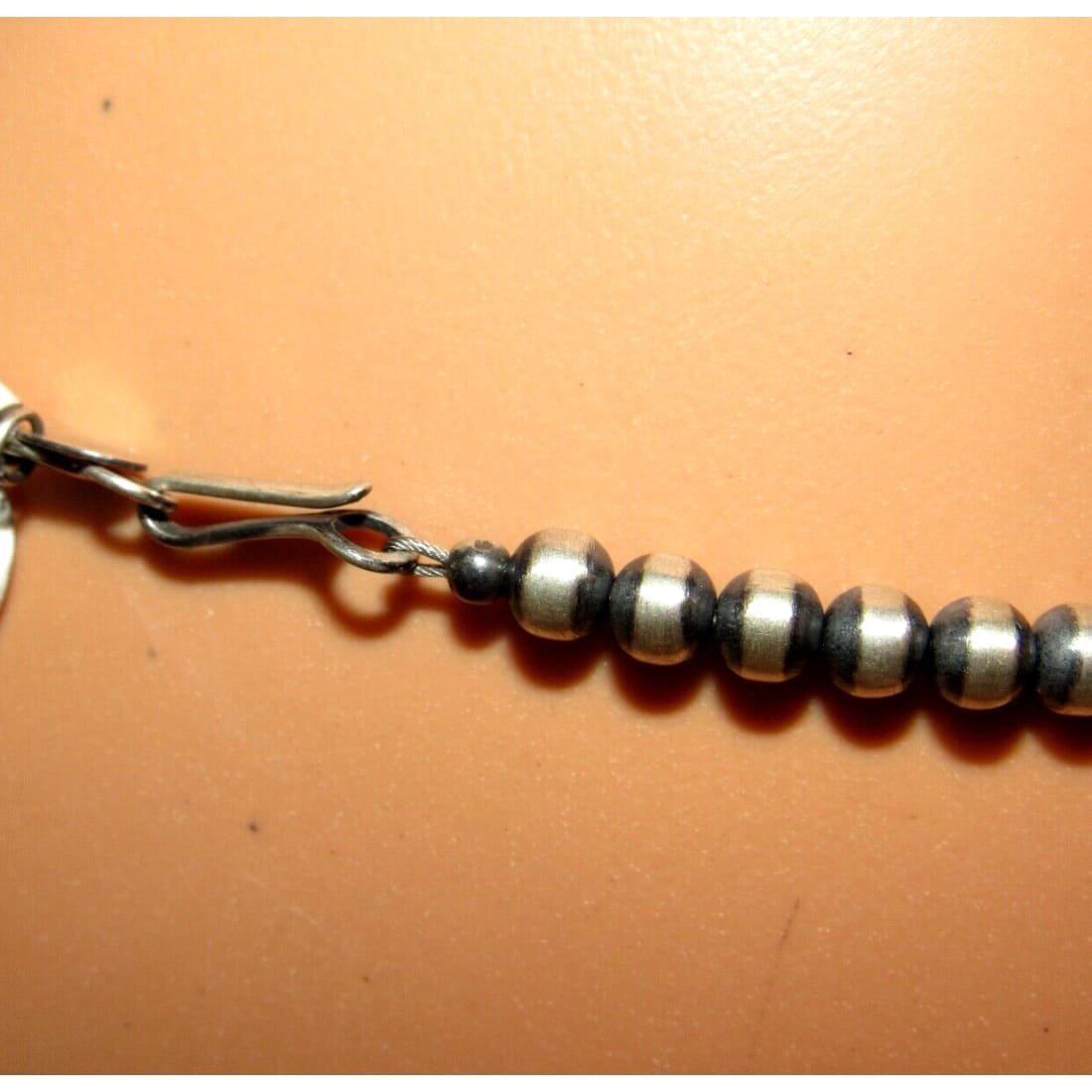 Close-up of Native American Navajo pearls necklace sterling silver with round silver beads and clasp