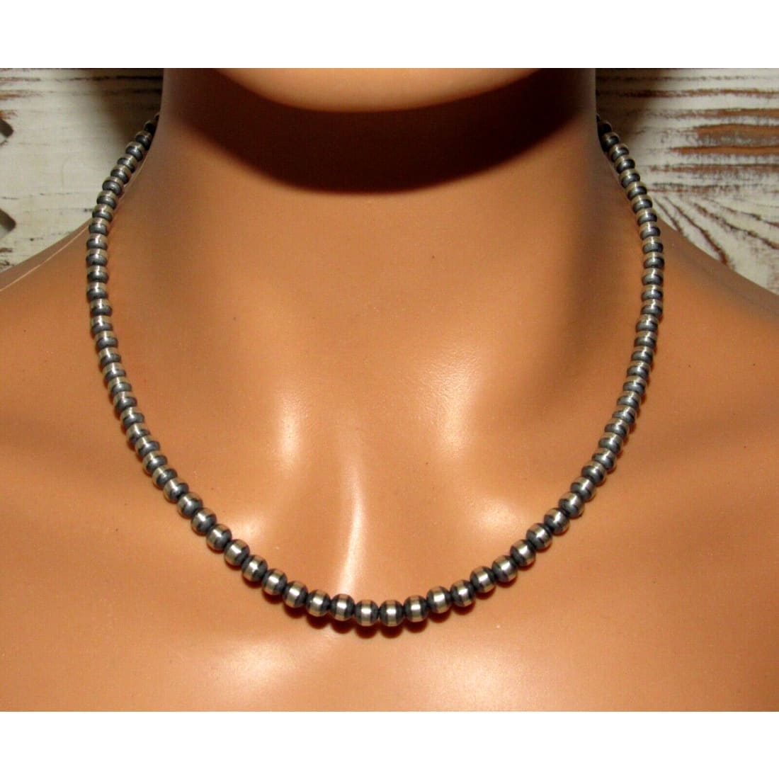 Navajo pearls necklace sterling silver with round beads displayed on mannequin neck