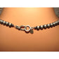 Close-up of Native American Navajo pearls necklace sterling silver clasp and beads on display
