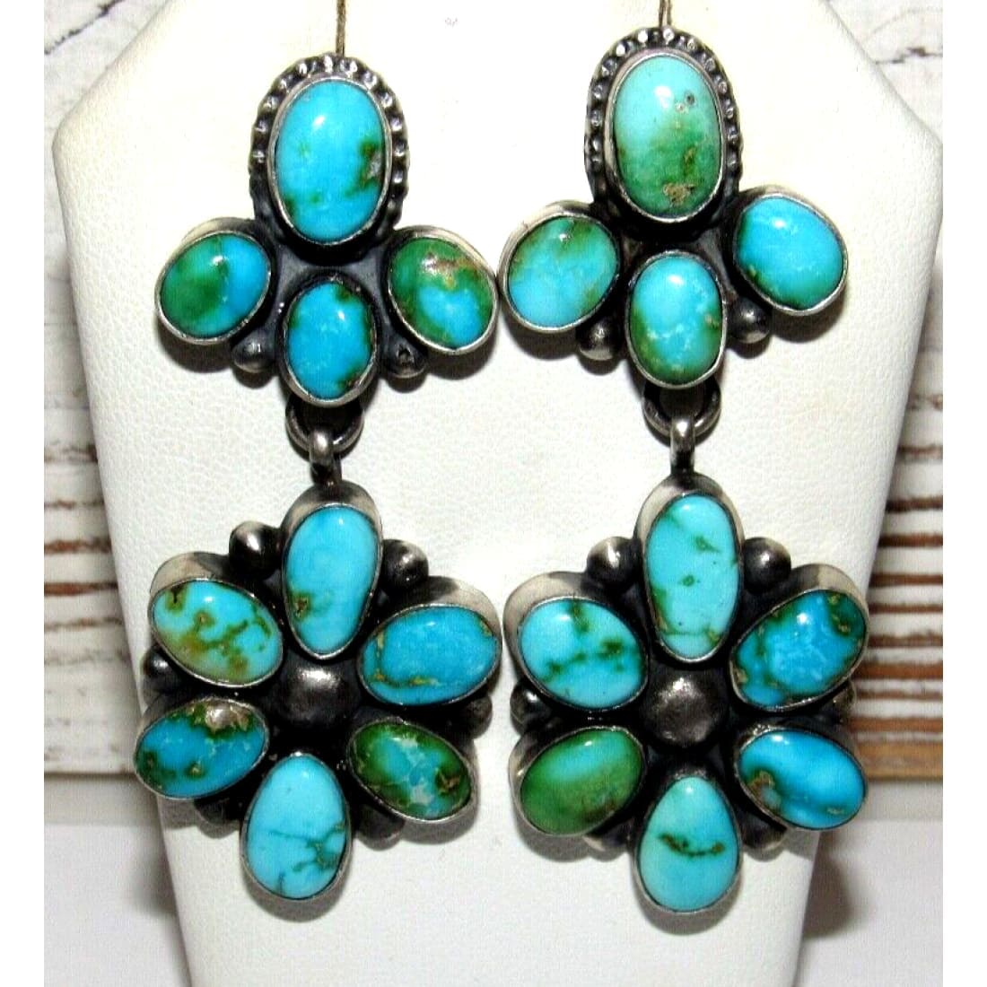 Sonoran gold turquoise dangle earrings featuring multiple oval turquoise stones set in silver