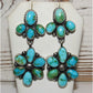 Sonoran gold turquoise dangle earrings featuring multiple polished turquoise stones in silver setting