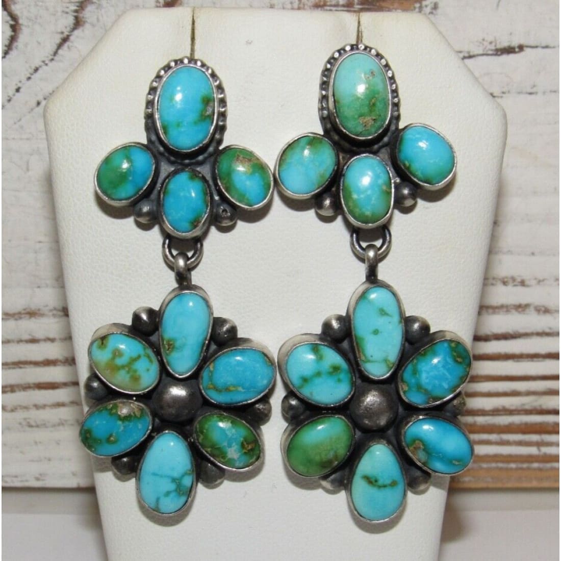 Sonoran gold turquoise dangle earrings featuring multiple polished turquoise stones in silver setting