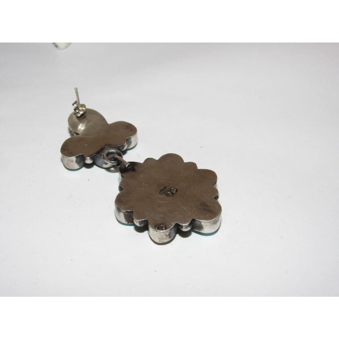 Back view of Sonoran gold turquoise dangle earrings showing silver metal and post details