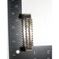 Zuni snake eye bracelet silverwork shown with ruler for size