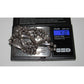 Vintage Navajo squash blossom necklace in silver displayed on digital scale showing weight