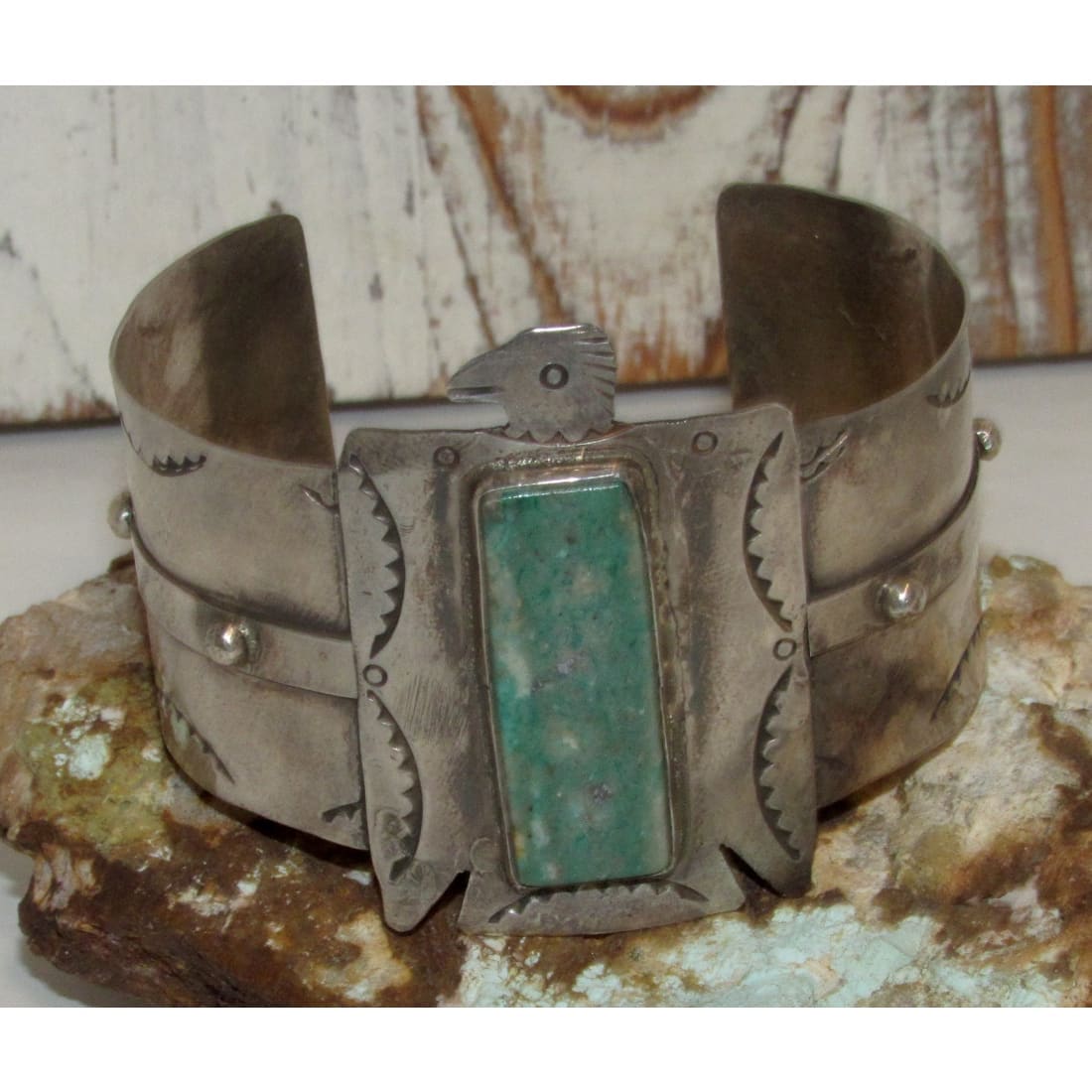 Native American Navajo Thunderbird cuff bracelet with turquoise stone and detailed silver work
