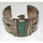 Native American Navajo Thunderbird cuff bracelet with turquoise stone and silver detailing