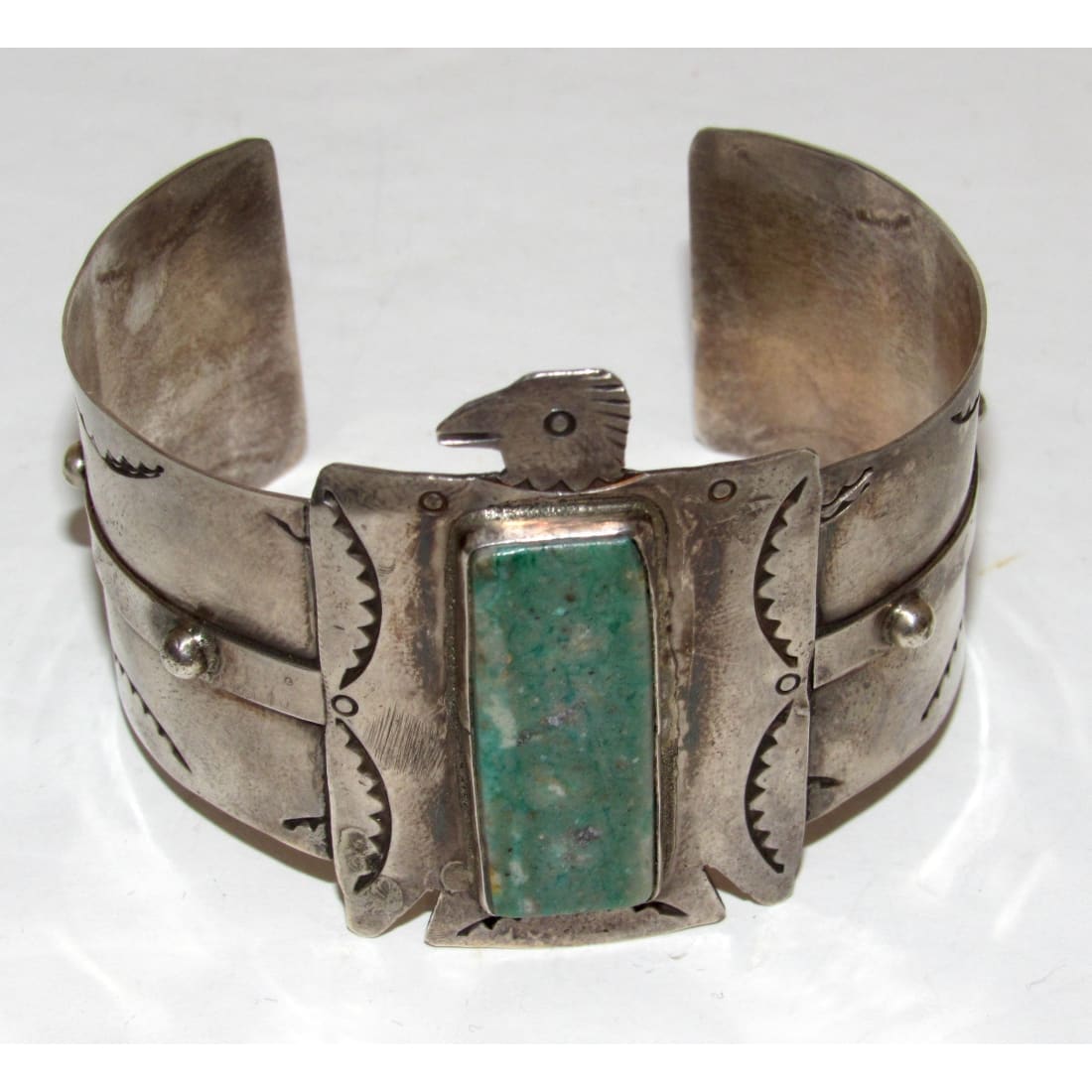 Native American Navajo Thunderbird cuff bracelet with turquoise stone and silver detailing