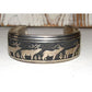 Native American Tommy Singer sterling silver bracelet featuring detailed elk and tree designs